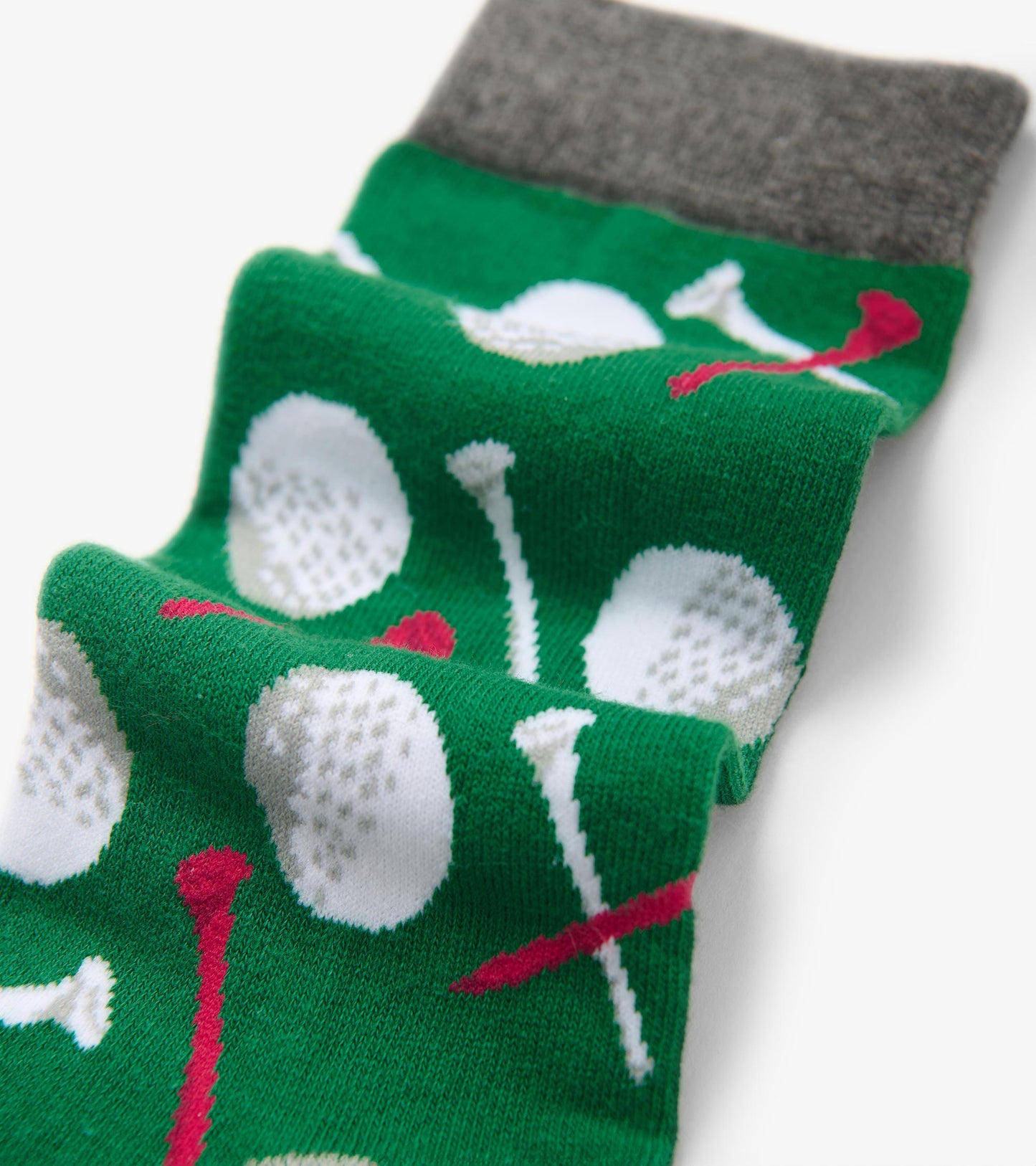 Green socks featuring golf balls and tees pattern with a gray cuff. One size fits all.