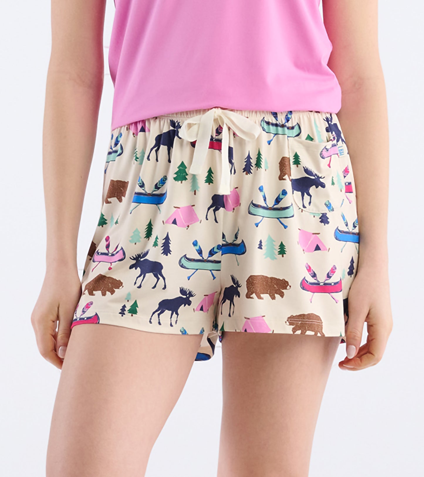 Beige pajama shorts featuring a playful camping and wildlife print, with an elastic waistband and drawstring.