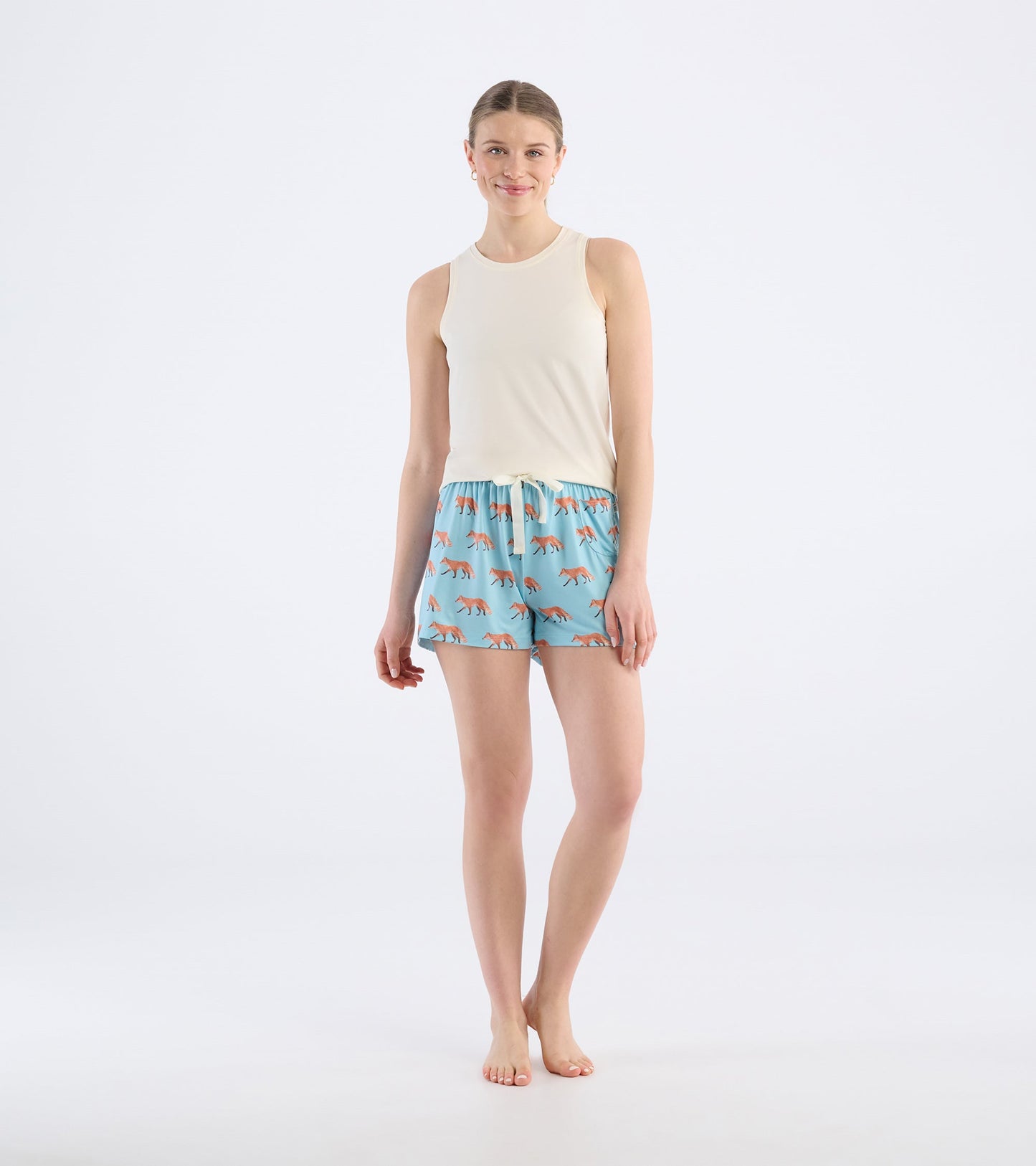 Light blue pajama shorts featuring a playful fox pattern, with an elastic waistband and drawstring for comfort.