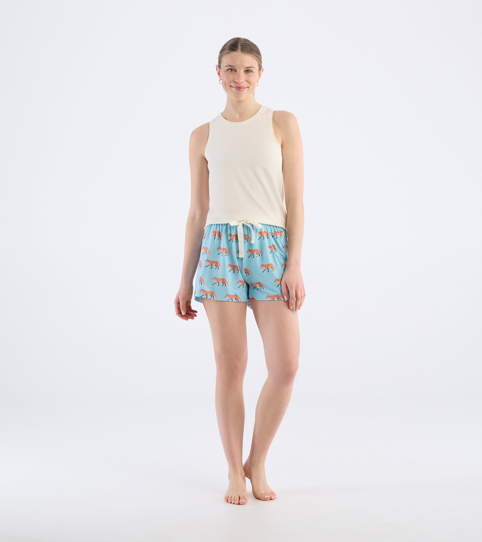 Light blue pajama shorts featuring a playful fox pattern, with an elastic waistband and drawstring for comfort.