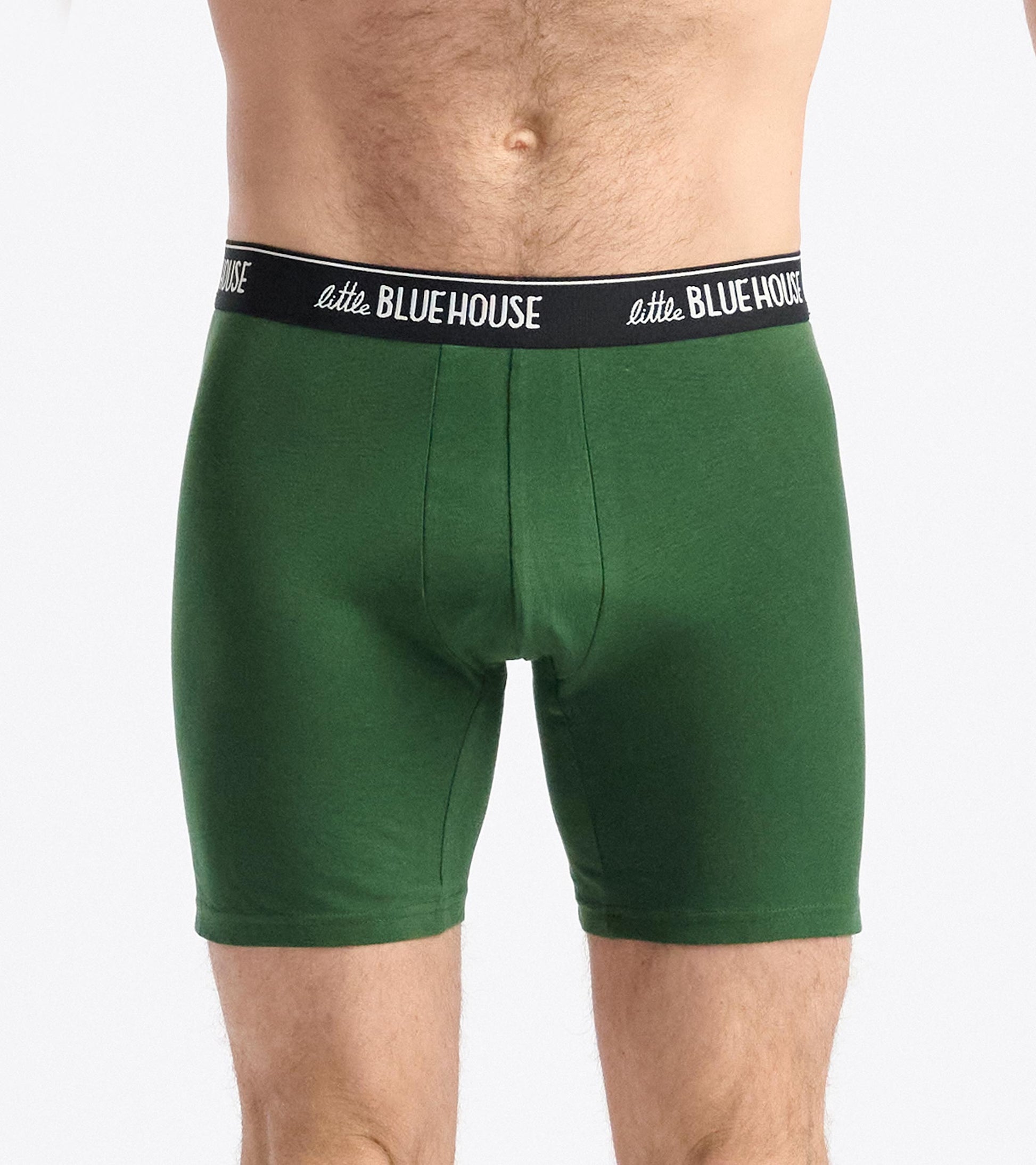 Green cotton boxer briefs with a black waistband, featuring a snug fit and mid-thigh length.