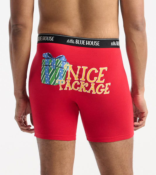 Red boxer briefs featuring a gift graphic and "NICE PACKAGE" text on the back, with a black waistband.