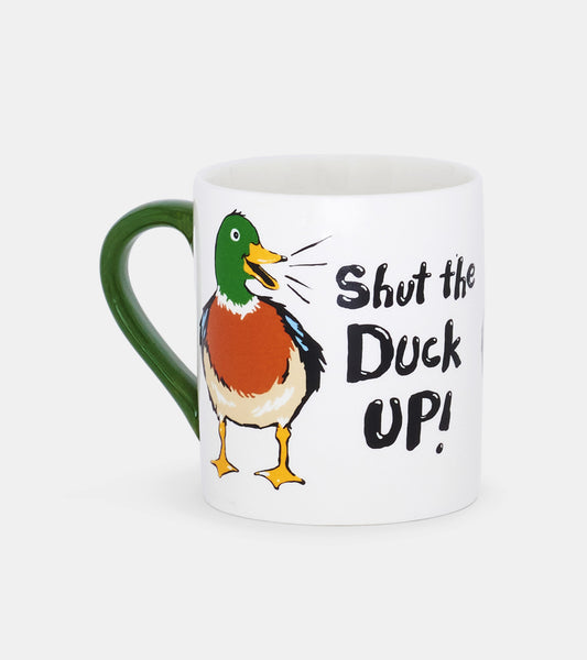 White ceramic mug with a green handle featuring a colorful duck illustration and the text "Shut the Duck Up!