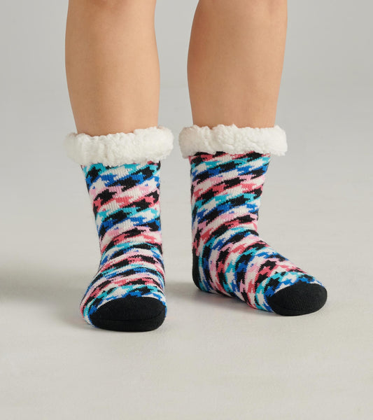 Colorful houndstooth pattern women's cabin socks with a fluffy white cuff, designed for warmth and comfort.