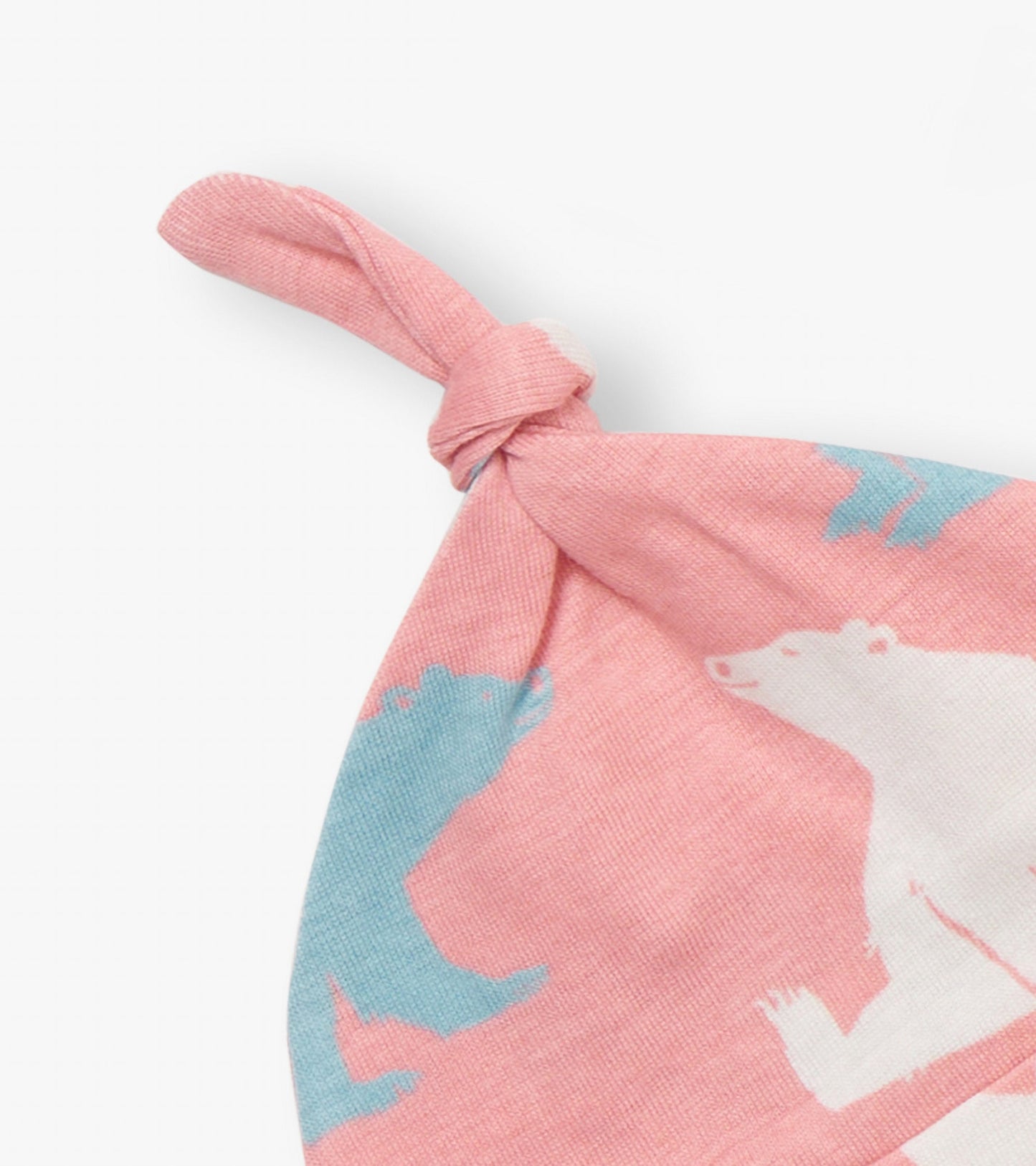 Baby pink hat with polar bear print and a knotted top, suitable for infants.