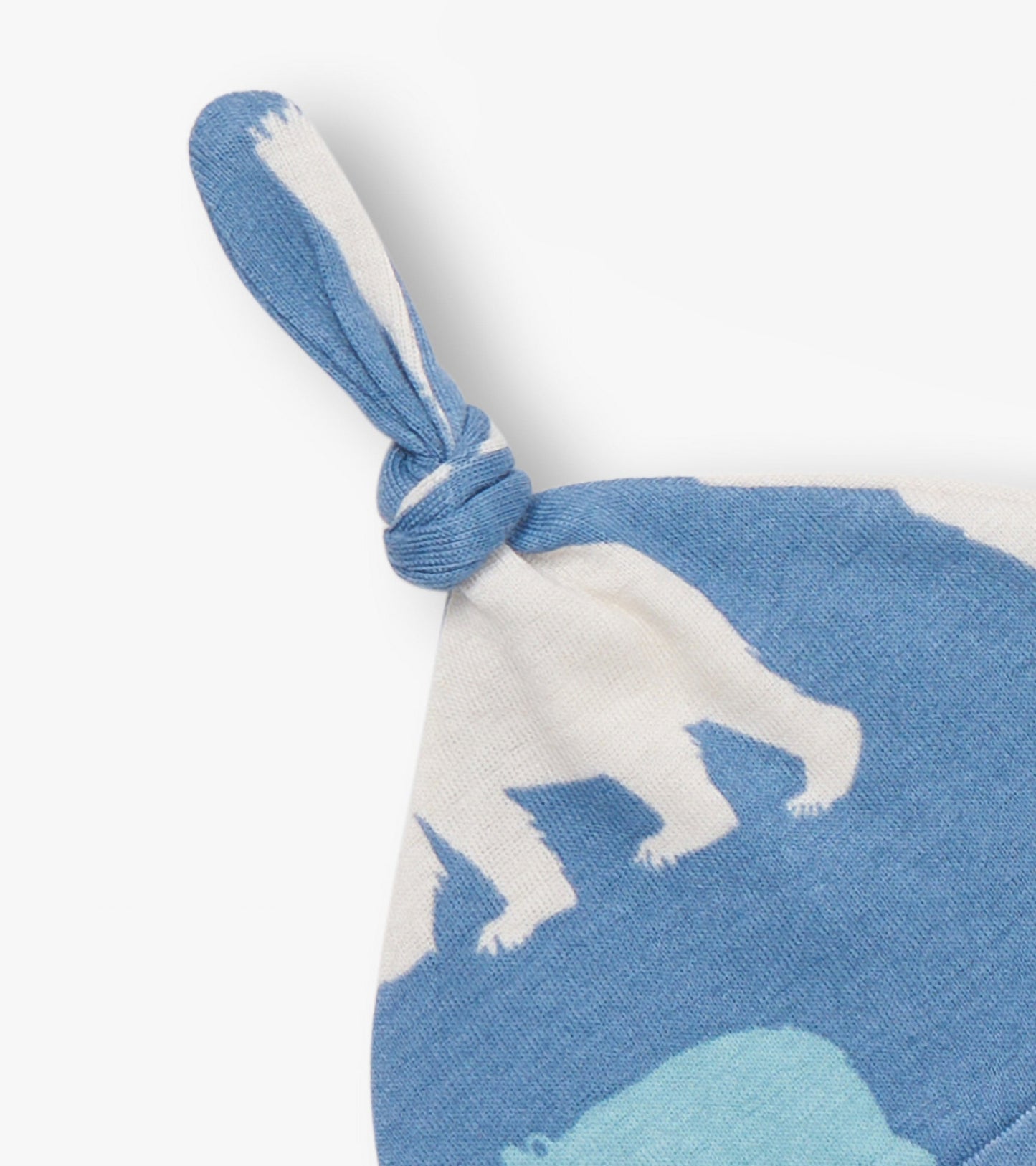 Baby blue hat featuring polar bear design with a knotted top, made from soft fabric suitable for infants.