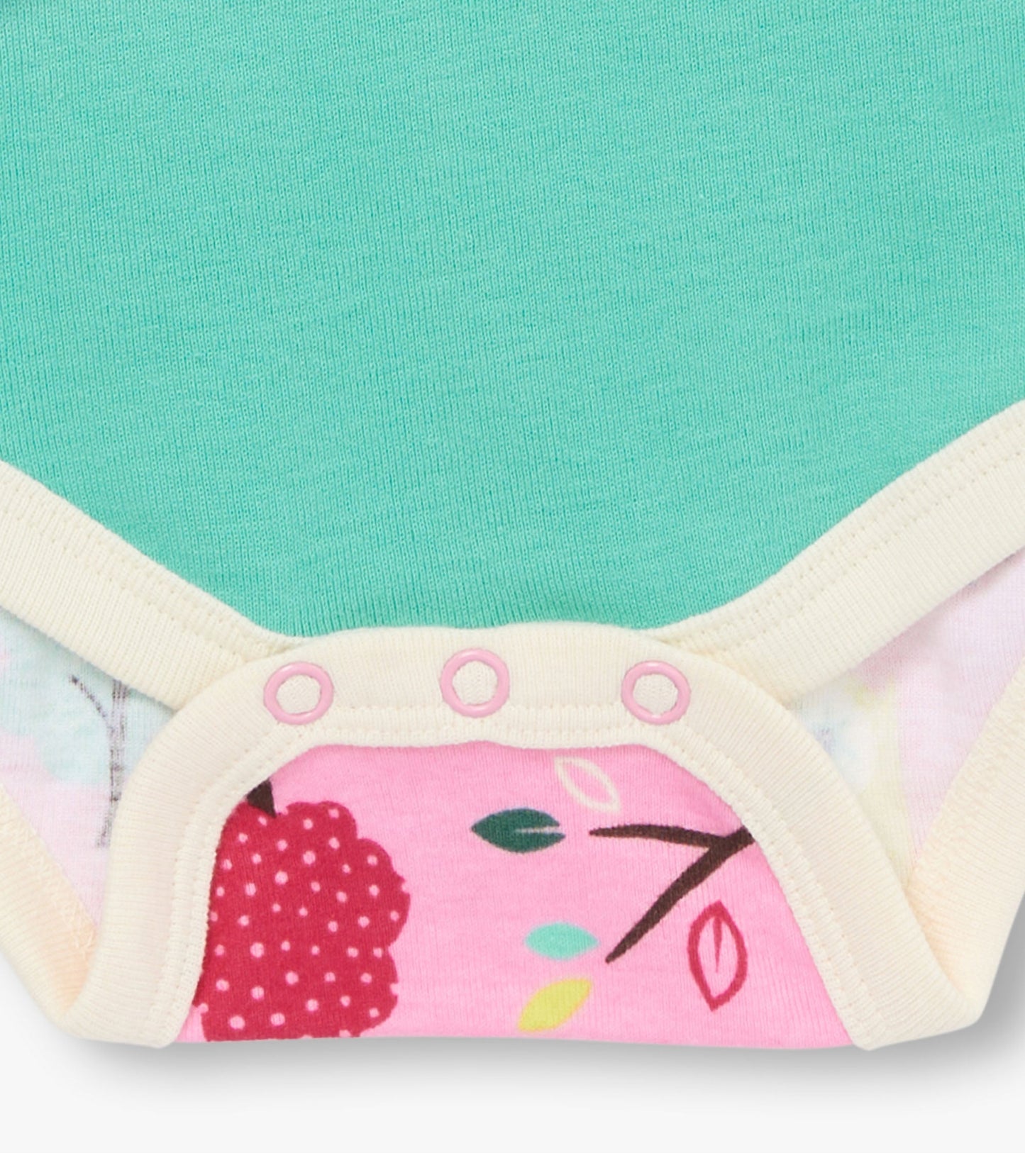 Light teal bodysuit with a colorful floral print on the bottom, featuring snap closures at the crotch.