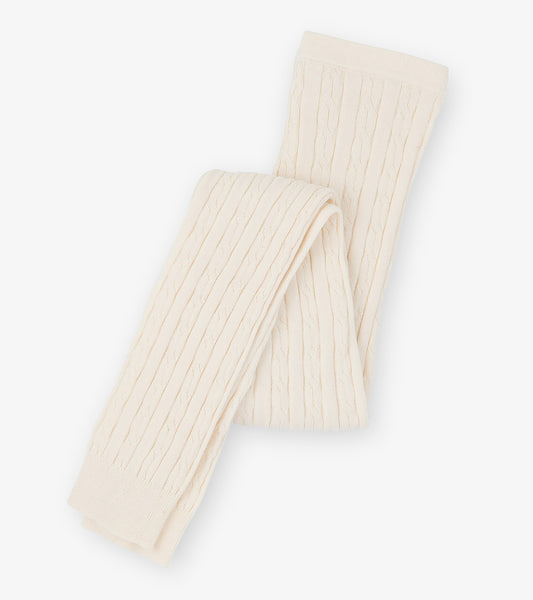 Cream cable knit tights with a textured pattern, folded neatly. Suitable for girls in various sizes.