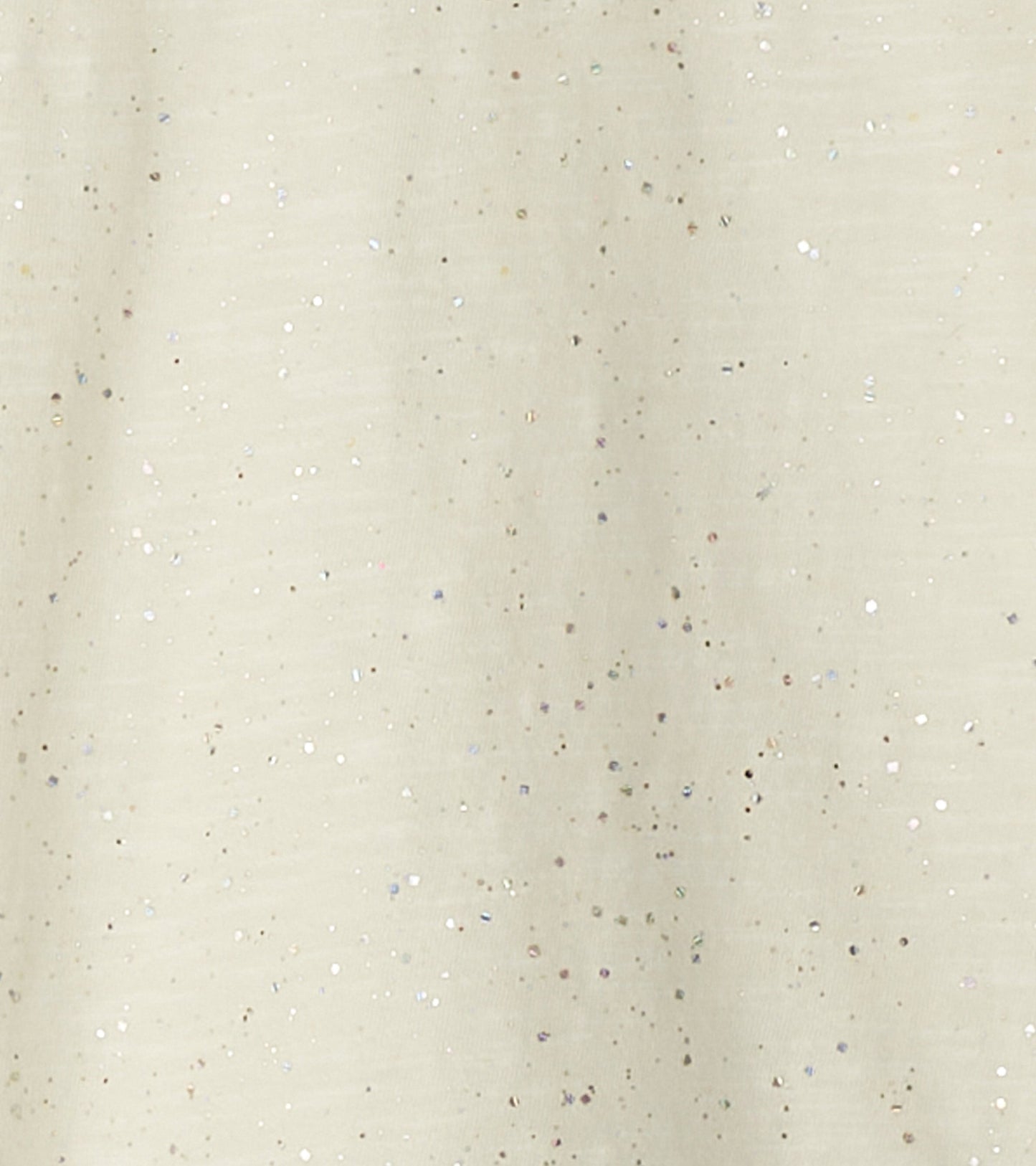 Light beige long sleeve graphic tee with scattered silver glitter accents. Soft fabric suitable for casual wear.