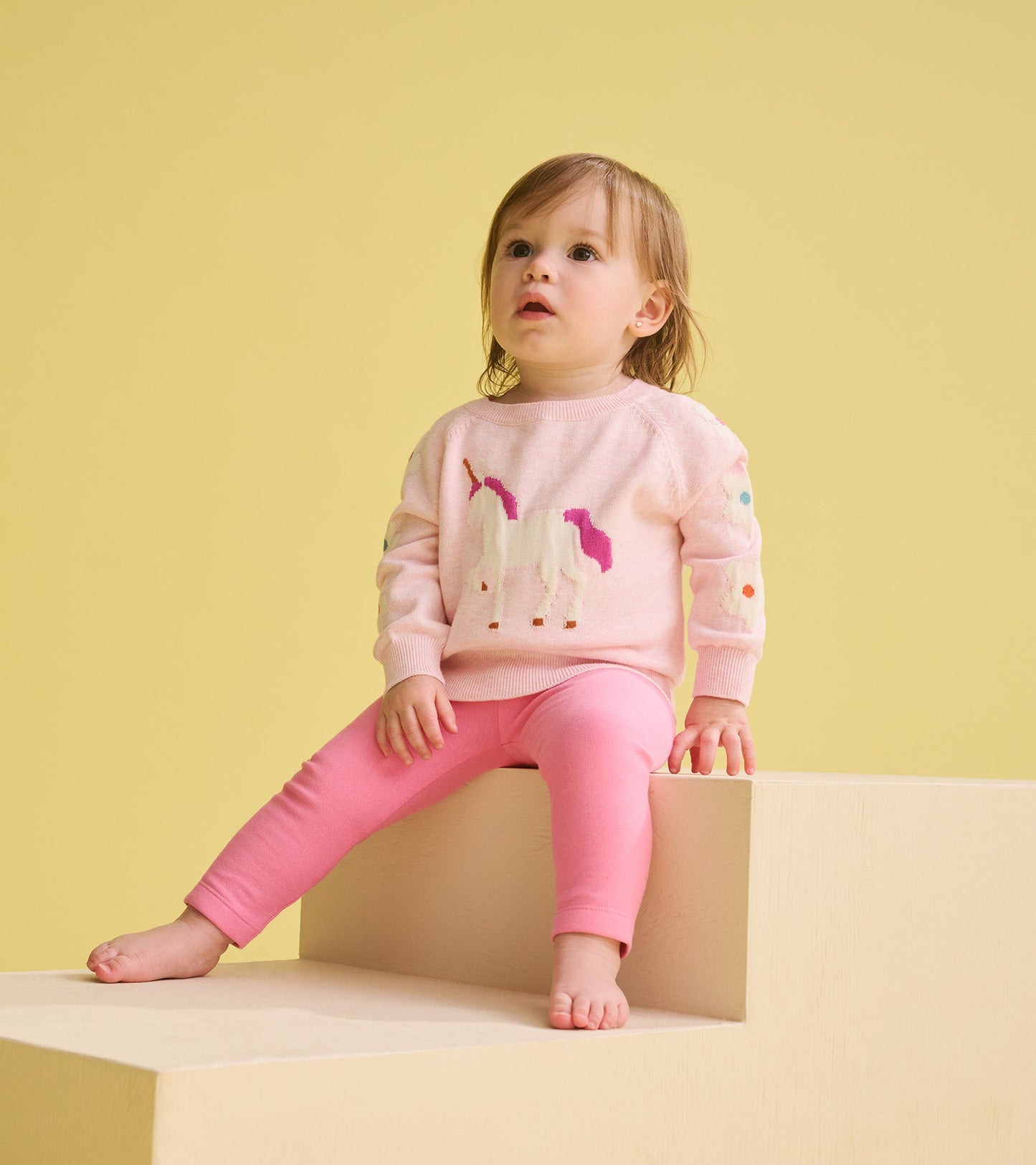 Pink cozy leggings for infants, featuring a snug fit and soft material, perfect for casual wear.