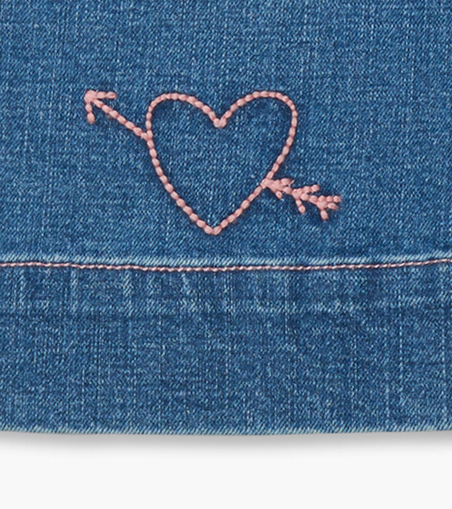 Blue stretch denim wide leg pants featuring a pink heart and arrow embroidery detail.