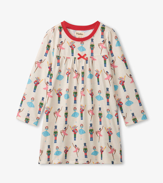 Cream long sleeve nightgown featuring a colorful nutcracker and ballet dancer print with a red neckline and bow detail.