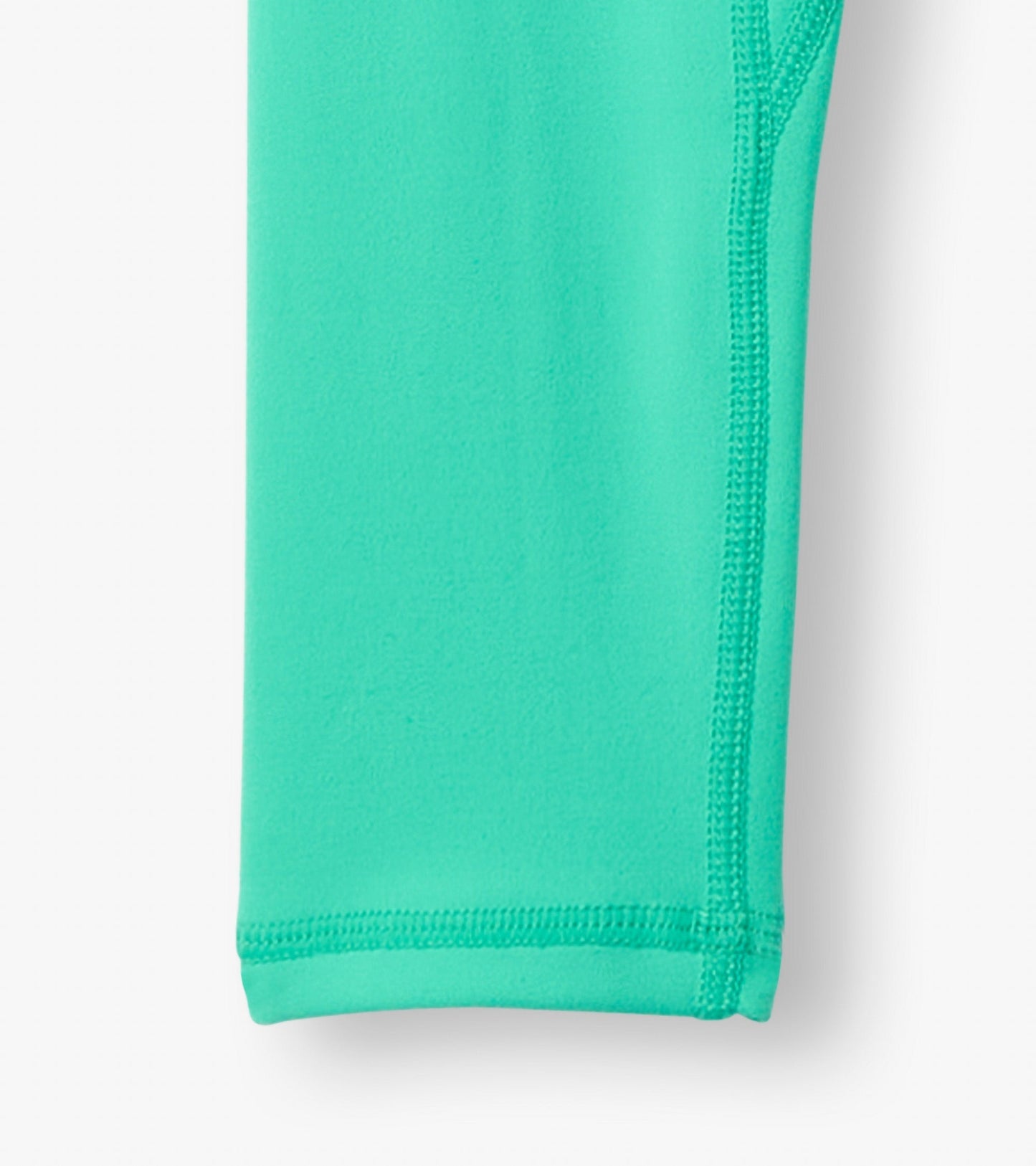 Aqua green active leggings with a smooth texture and stitched seams, suitable for active wear.