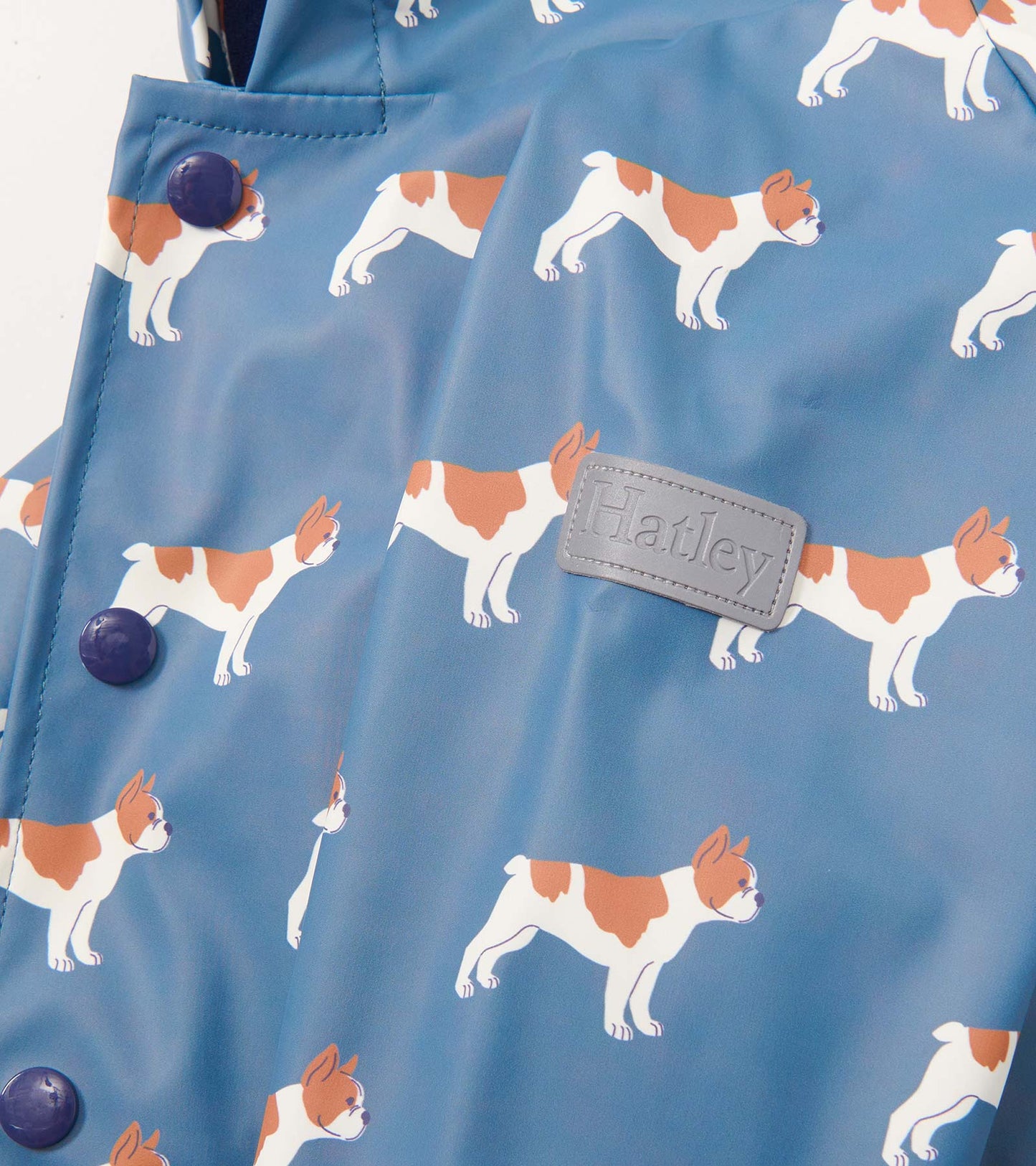 Blue rain jacket featuring a playful French bulldog pattern and purple buttons. Ideal for baby and toddler boys.