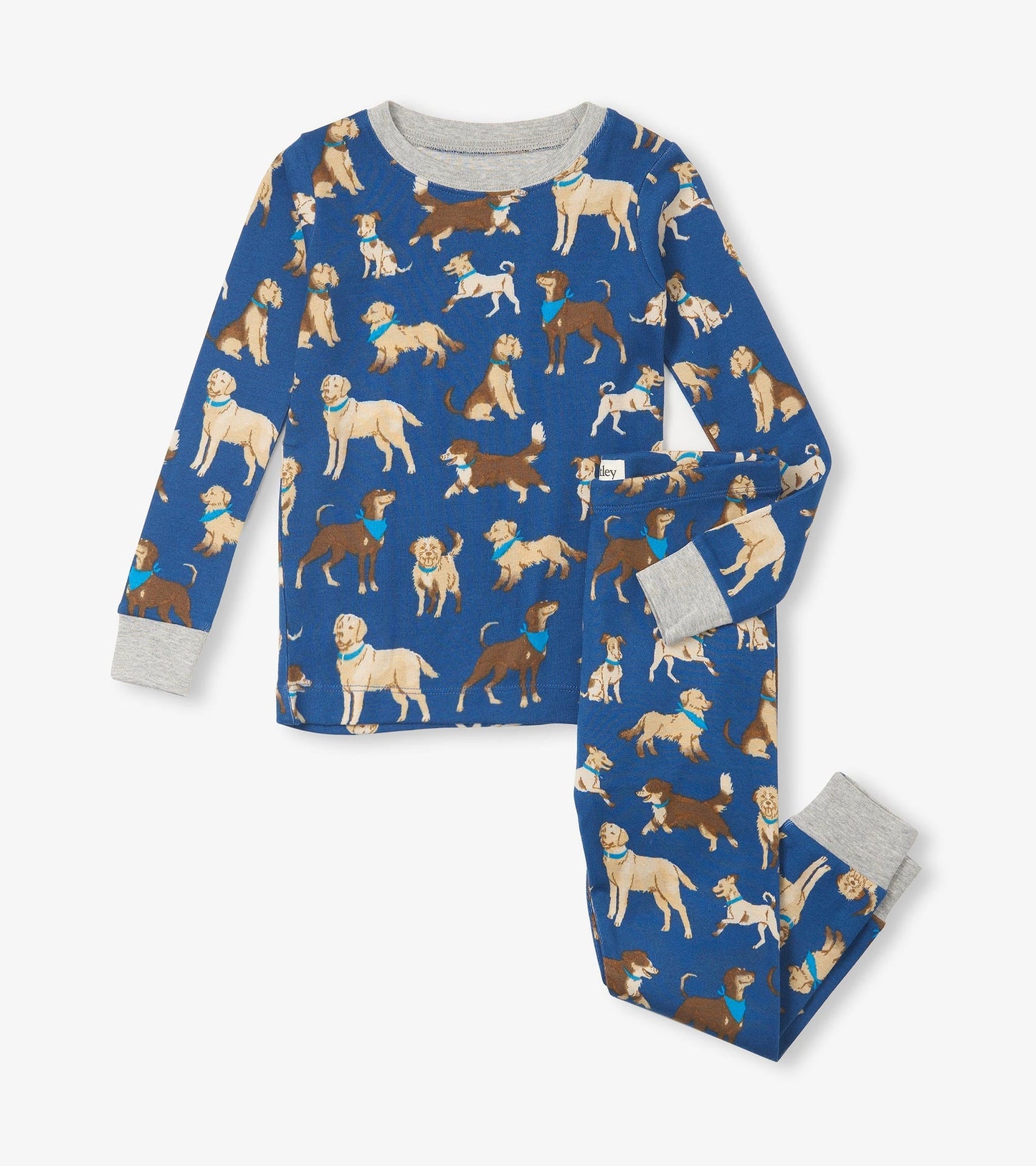 Blue organic cotton pajama set featuring various dog prints, with gray cuffs on the long-sleeve top and pants.