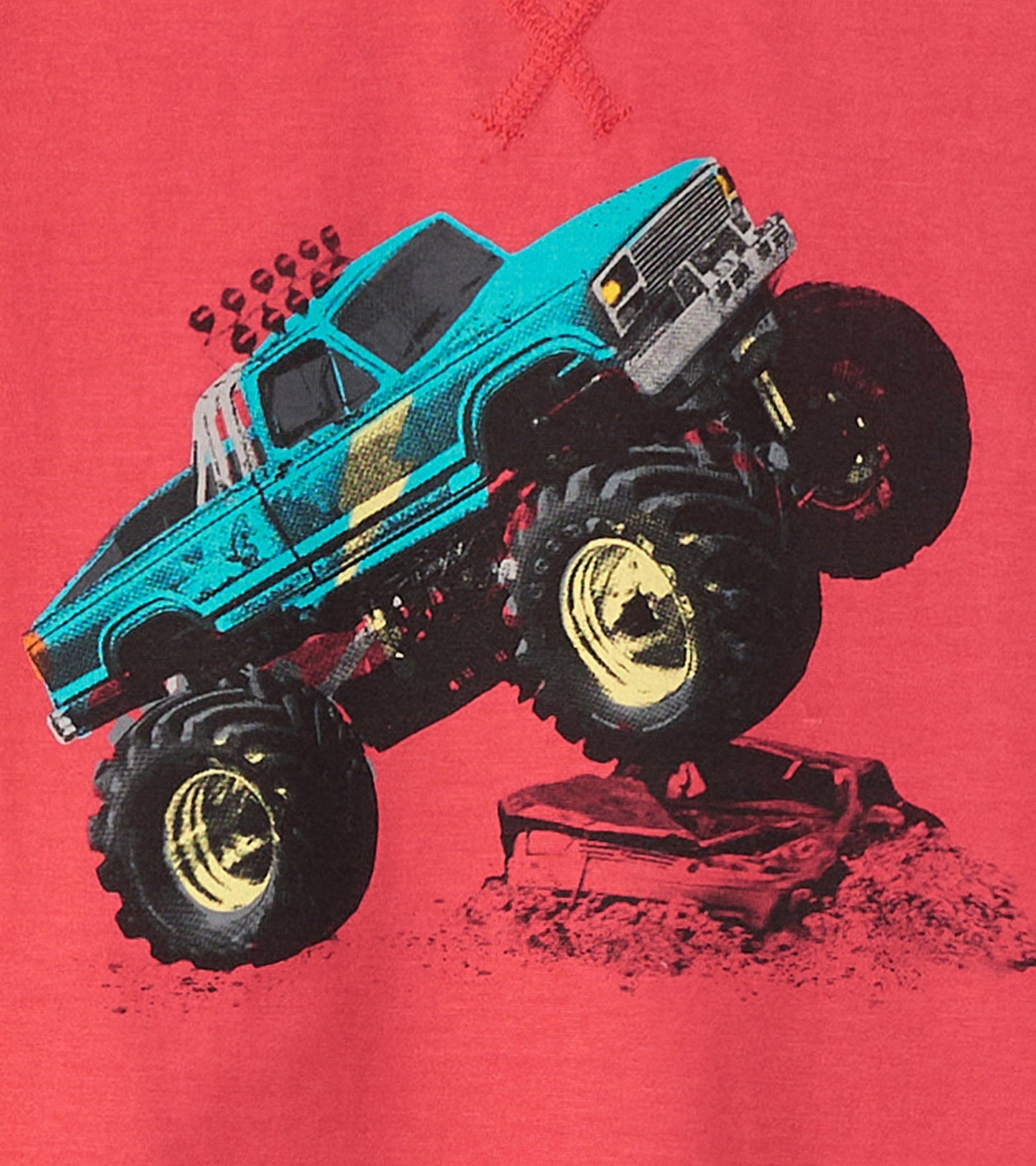 Red long sleeve raglan t-shirt featuring a colorful graphic of a monster truck crushing a car.