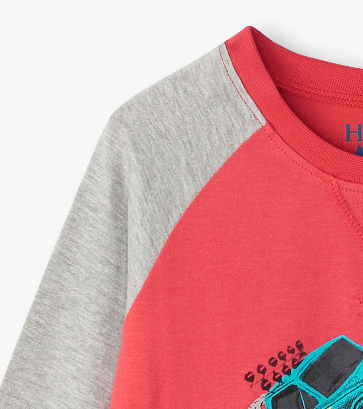 Red long sleeve raglan t-shirt with gray sleeves, featuring a monster truck graphic on the front.