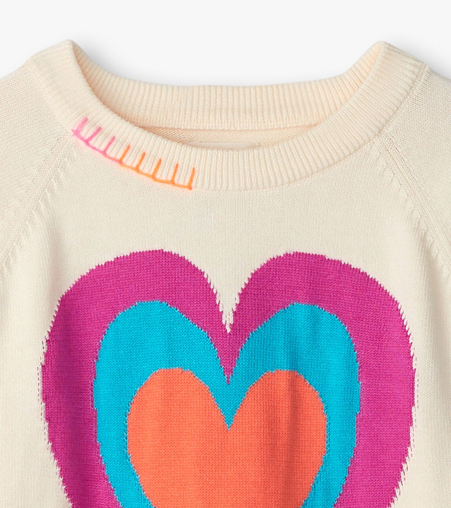 Cream sweater featuring a large layered heart design in pink, orange, and blue with colorful stitching on the neckline.