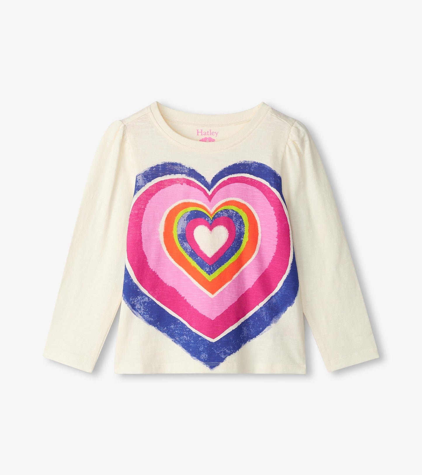 Long sleeve cream tee featuring a colorful layered heart graphic in pink, purple, and blue.
