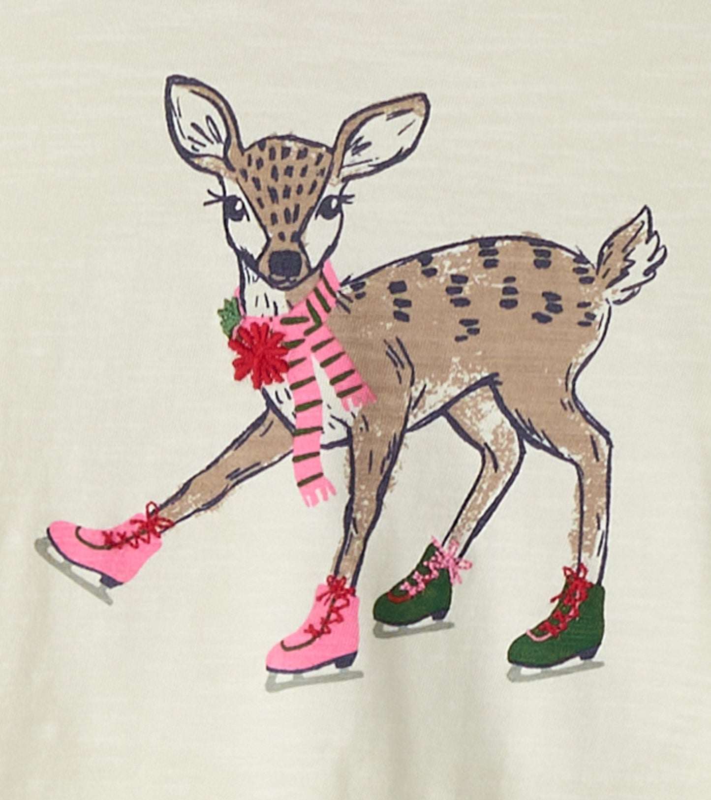 Light-colored long sleeve t-shirt featuring a skating deer graphic with pink and green ice skates.