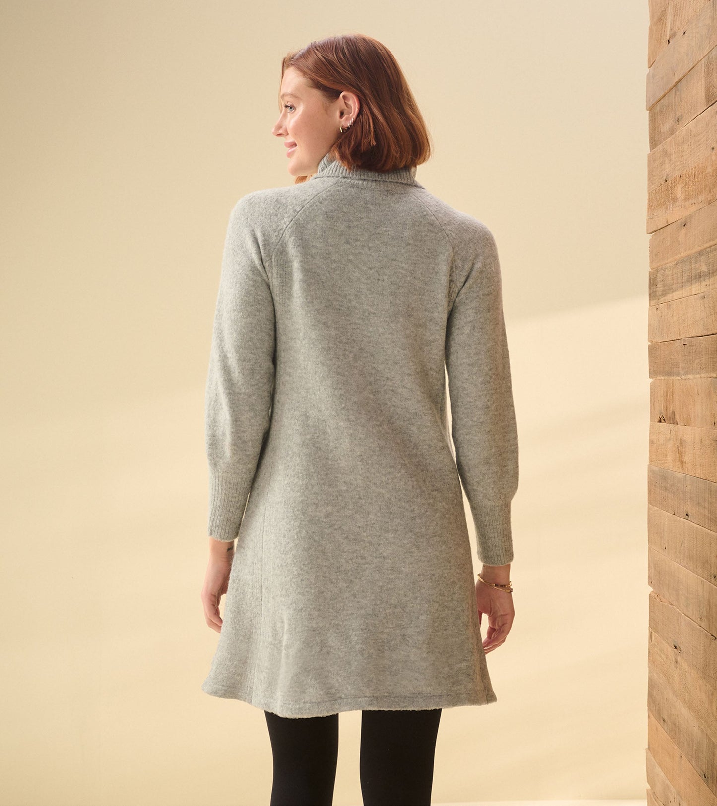 Grey heather sweater dress with a relaxed fit, long sleeves, and a turtleneck, shown from the back.