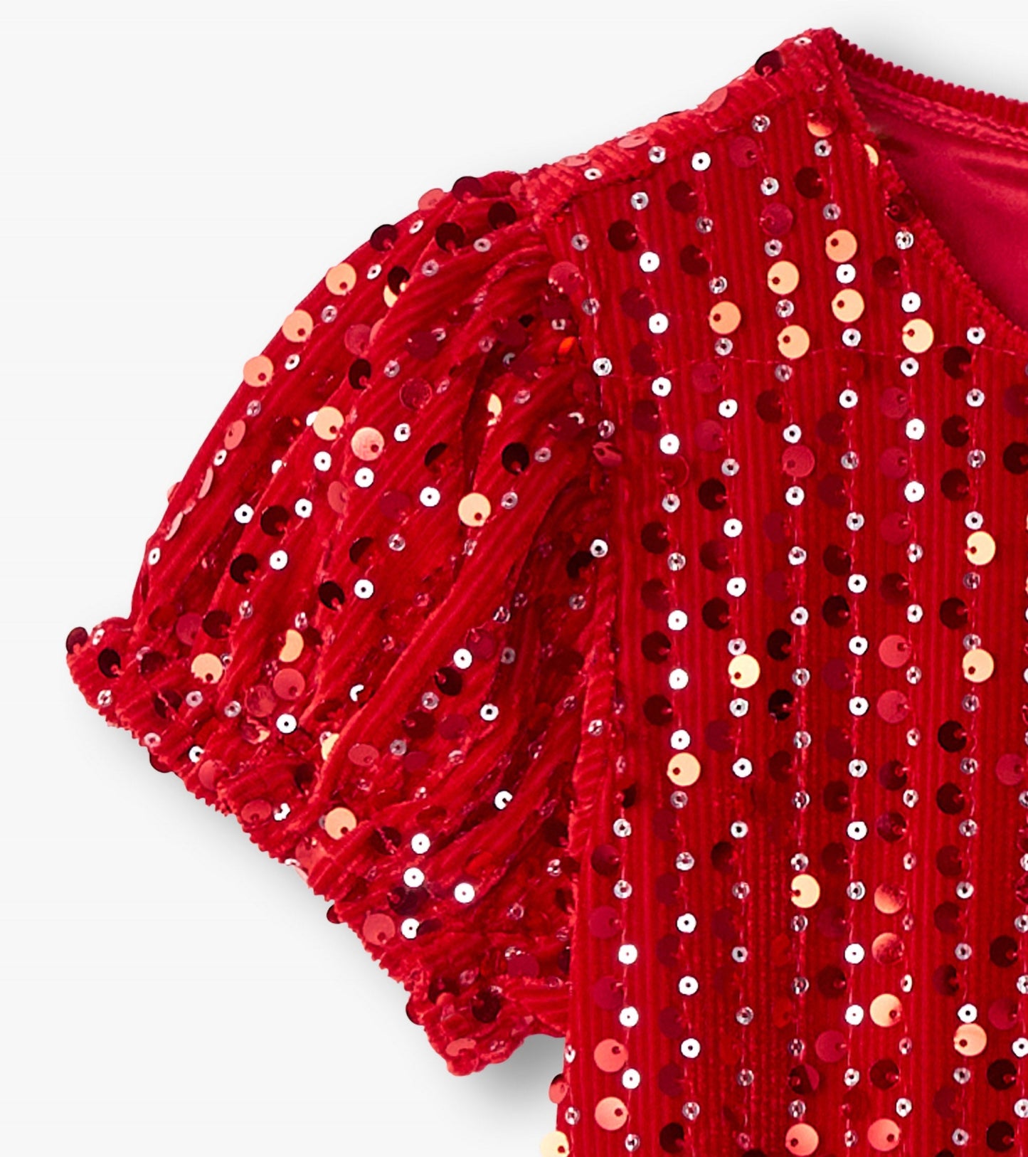 Red velvet dress with sequins, featuring puff sleeves and a round neckline.