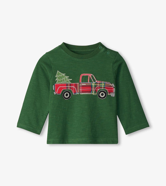 Green long sleeve t-shirt featuring an embroidered red plaid truck with a Christmas tree in the back.