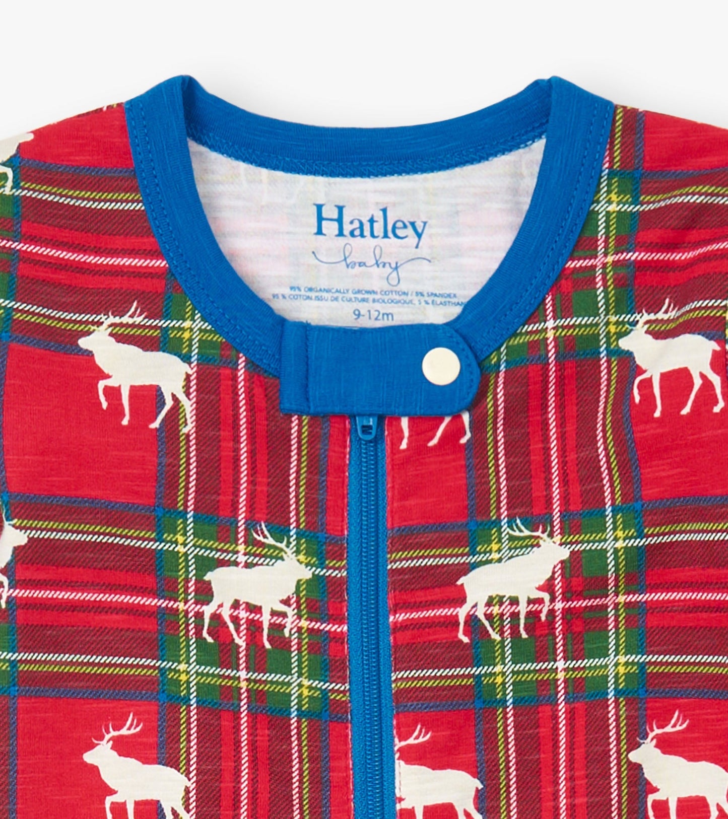 Red plaid footed sleeper with white elk print, featuring a blue neckline and zipper closure, suitable for infants.