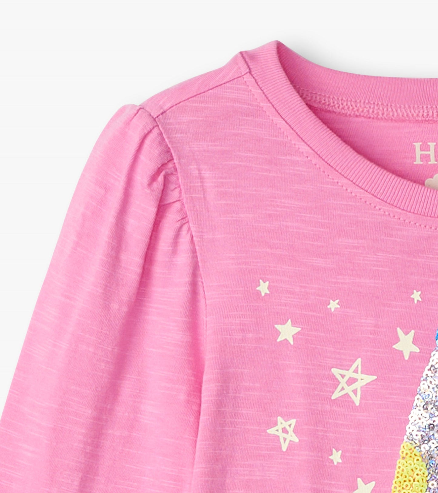 Pink long sleeve graphic tee featuring a colorful lava lamp design and star patterns. Soft, lightweight fabric.