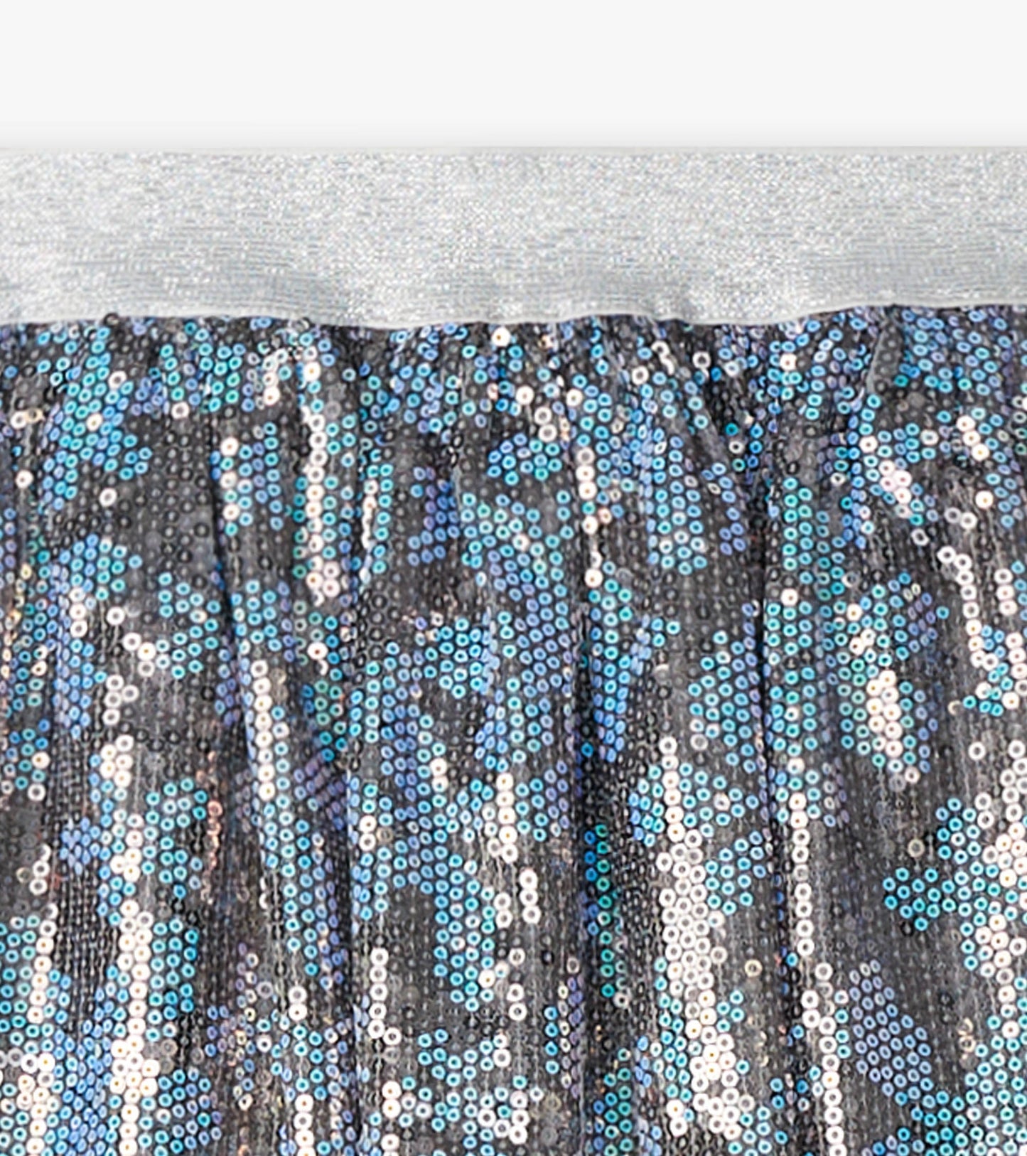 Shimmering tulle skirt with blue and silver sequins, featuring a silver elastic waistband.