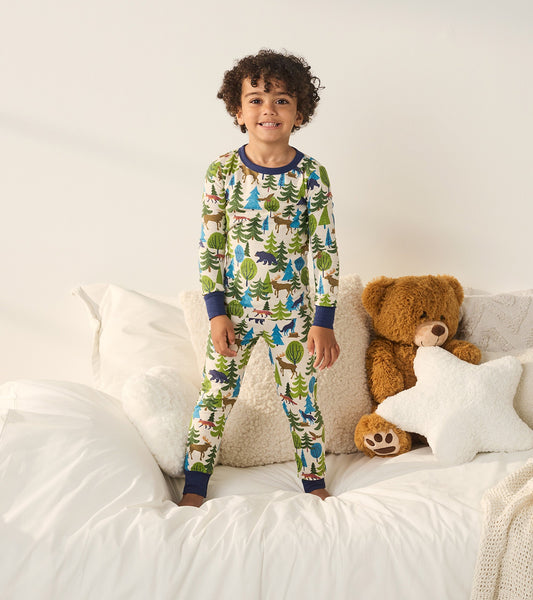 Boys' long-sleeve pajama set featuring a colorful forest scene with trees and animals, made from soft fabric.