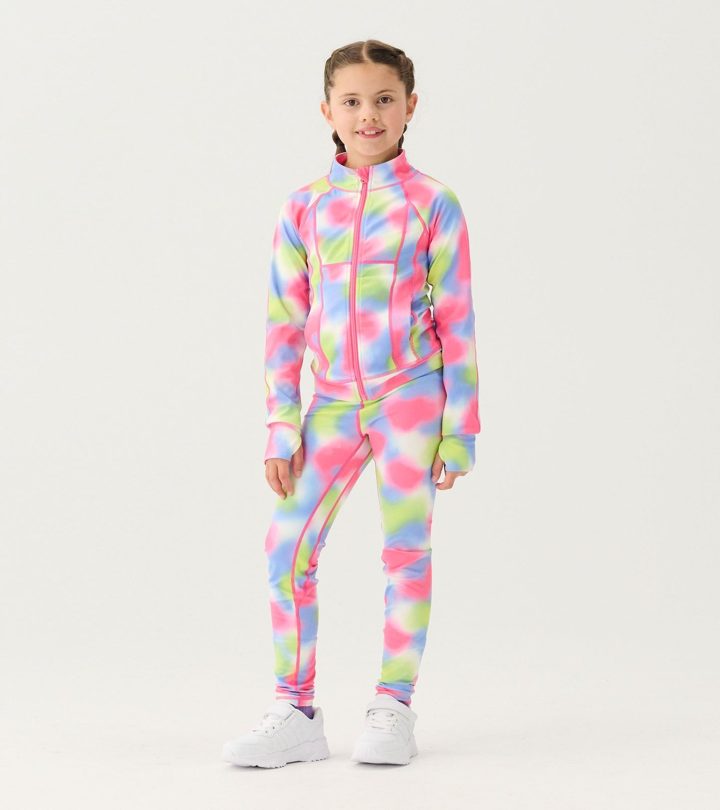 Colorful tie-dye active leggings in pink, green, and blue, designed for girls, featuring a snug fit for active wear.