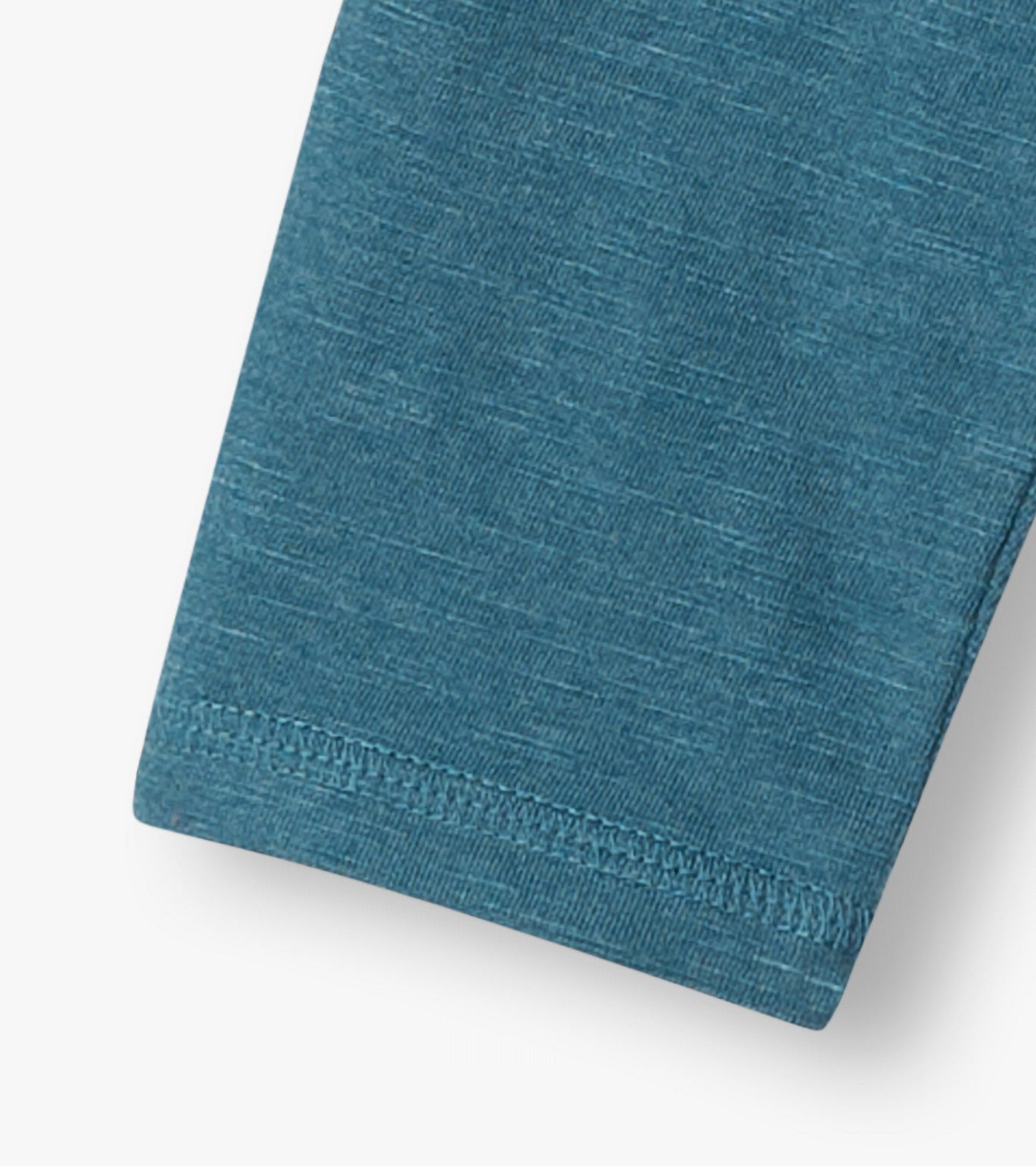Teal long sleeve t-shirt with a soft, textured fabric and a relaxed fit, showcasing a cuffed sleeve detail.