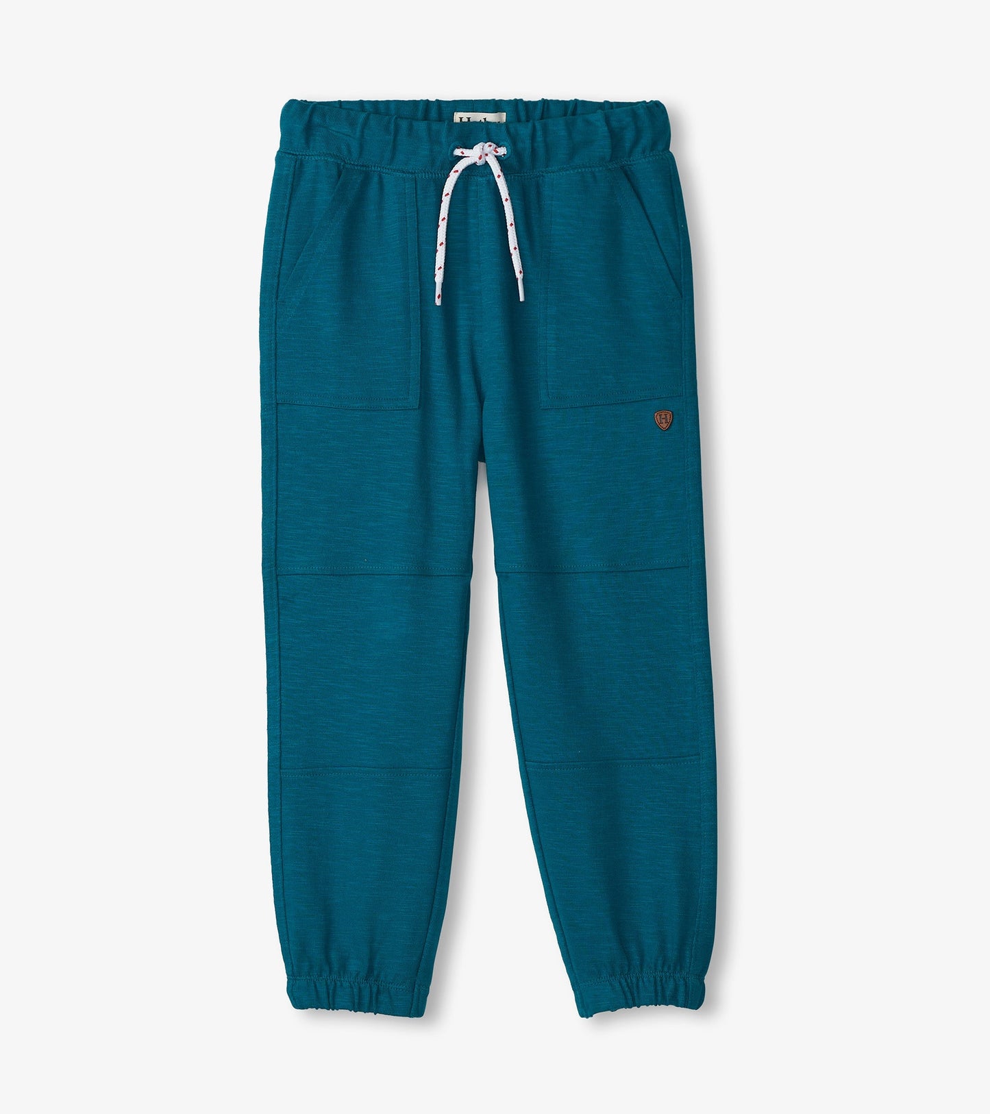 Cozy boys' pants in Moroccan blue, featuring an elastic waistband, drawstring, and side pockets.