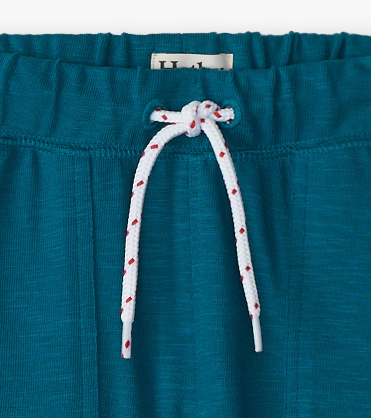 Moroccan blue cozy pants with an elastic waistband and white drawstring, perfect for casual wear.