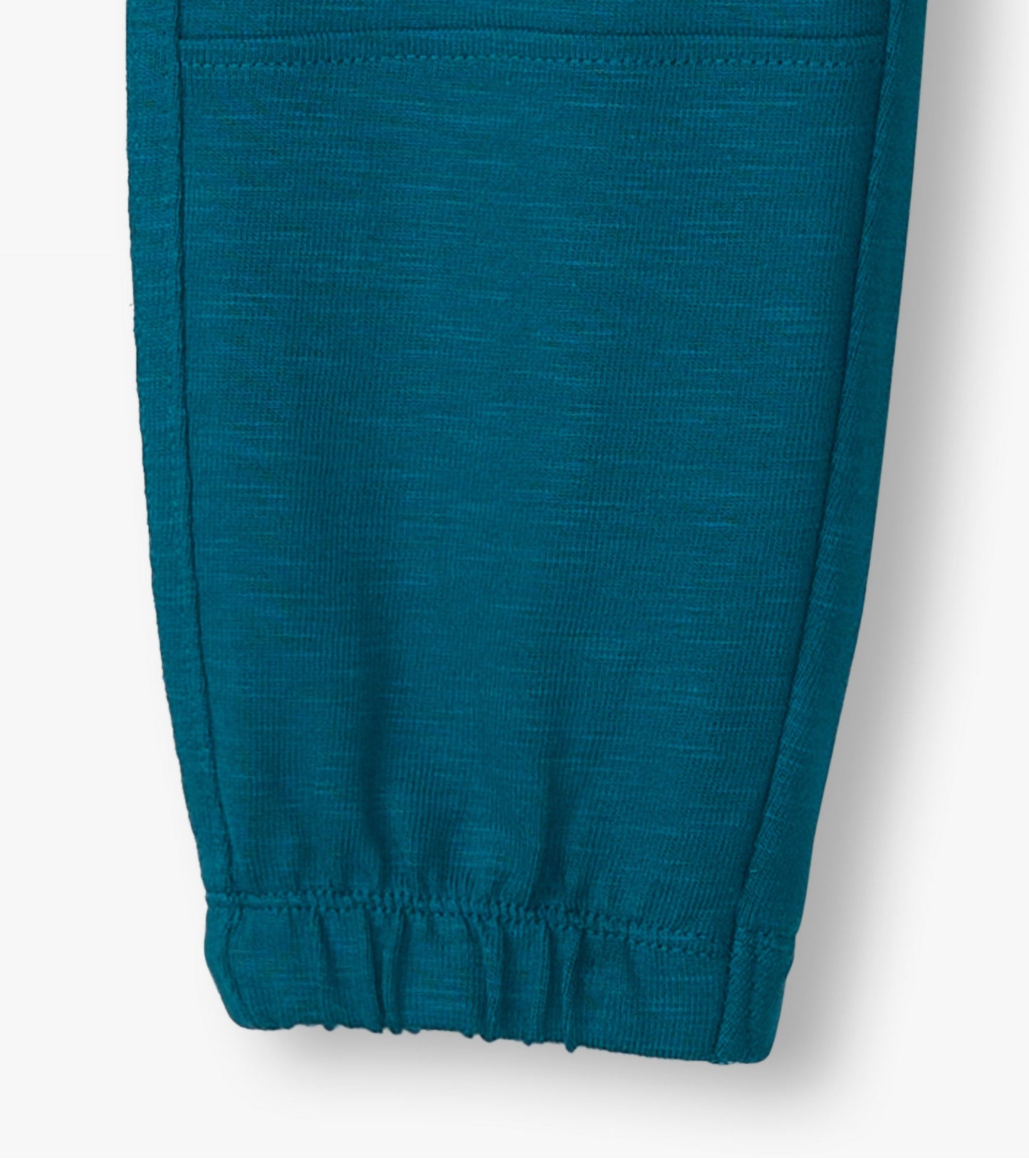 Cozy boys' pants in Moroccan blue, featuring a soft texture and elastic cuffs for comfort and ease of movement.