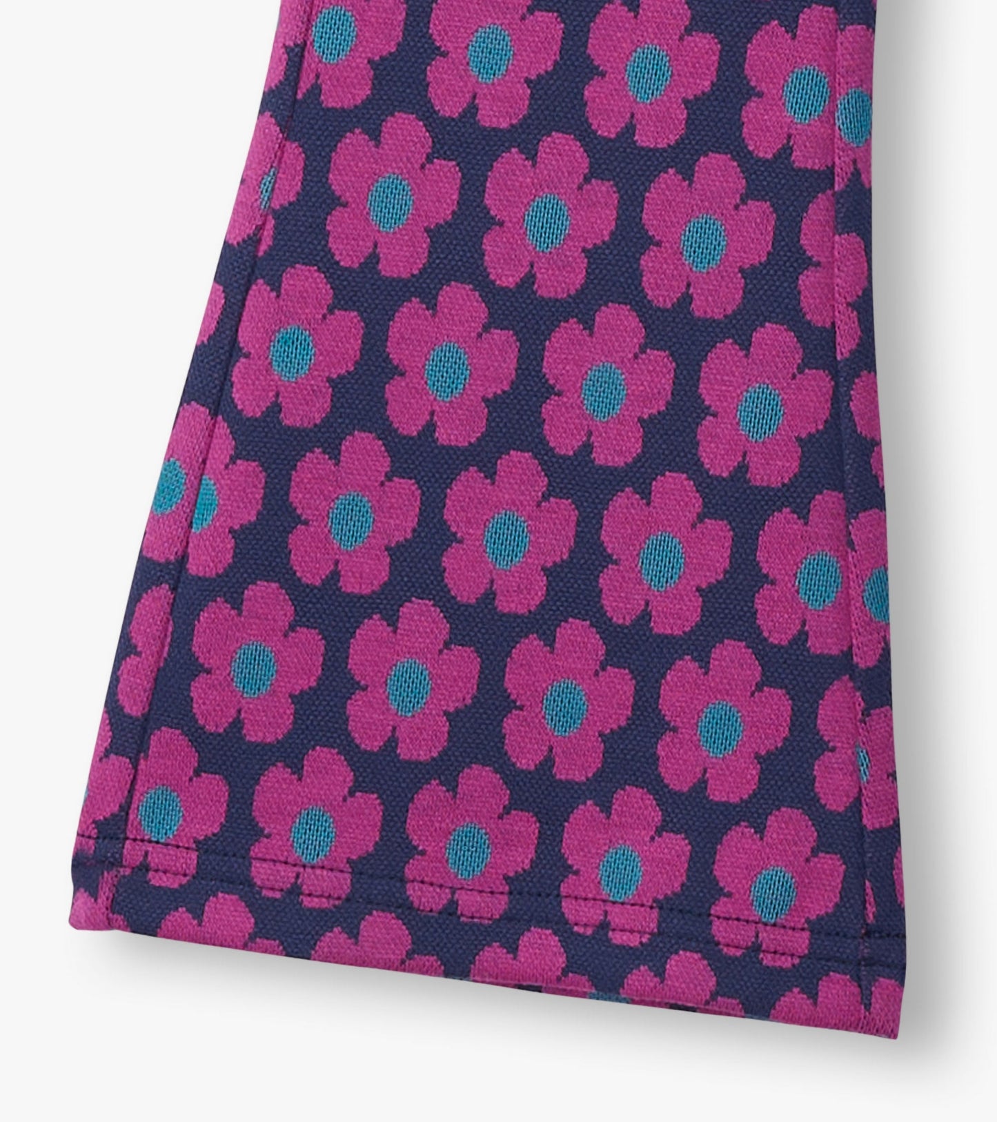 Navy pants featuring a vibrant pink and blue flower pattern, designed for girls with a flared waist.
