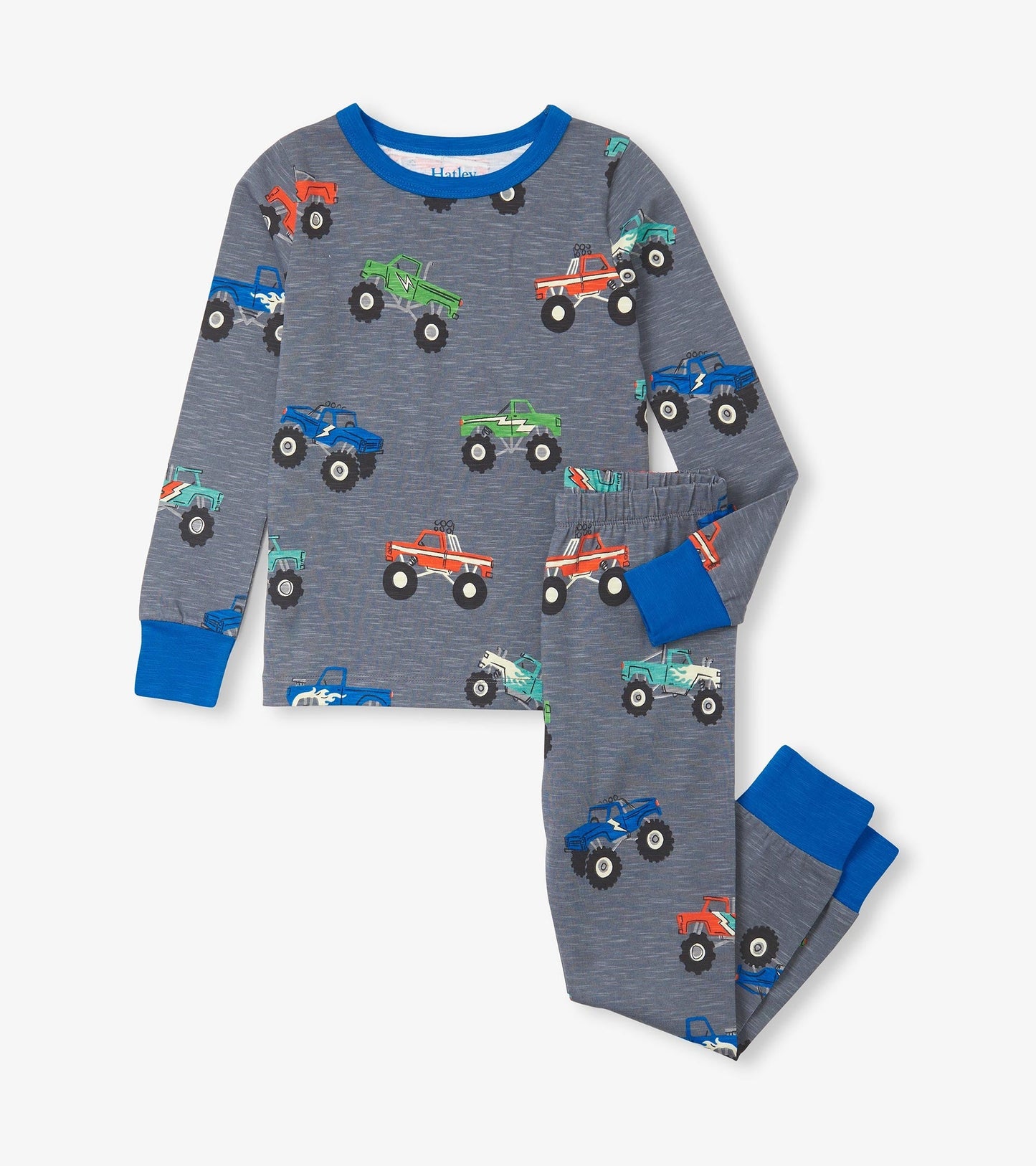 Gray pajama set featuring colorful monster truck prints, long sleeves, and elastic waistband pants with blue cuffs.