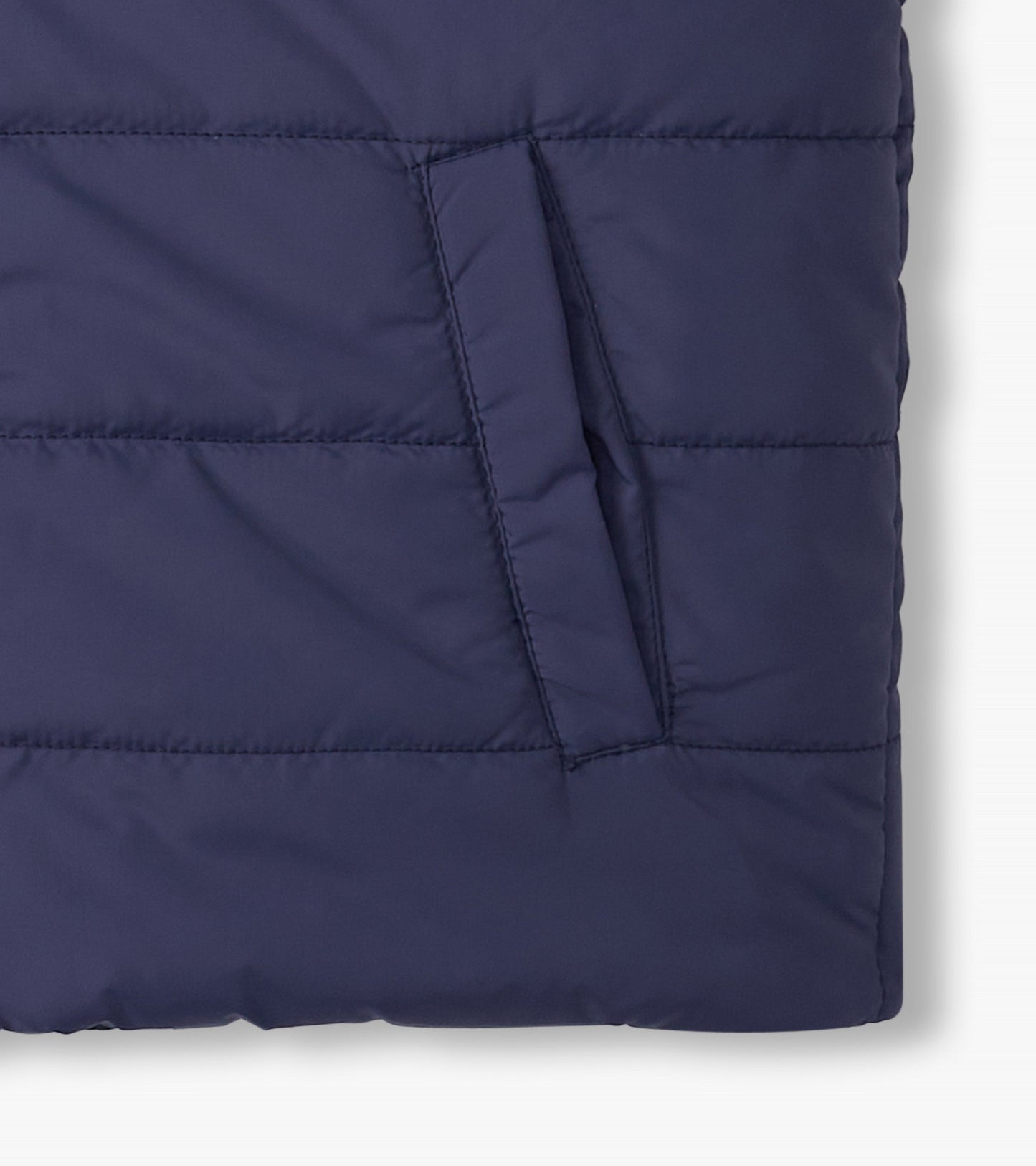 Navy blue reversible quilted vest with a side pocket, designed for boys, featuring a soft, padded material.