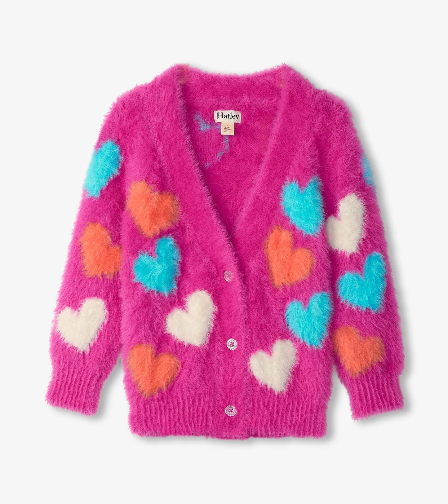 Fuzzy pink cardigan featuring colorful heart patterns in blue, orange, and white, with a button front and ribbed cuffs.