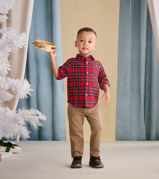 Red plaid button-down shirt for toddlers, featuring a collar and button closure, worn with khaki pants.
