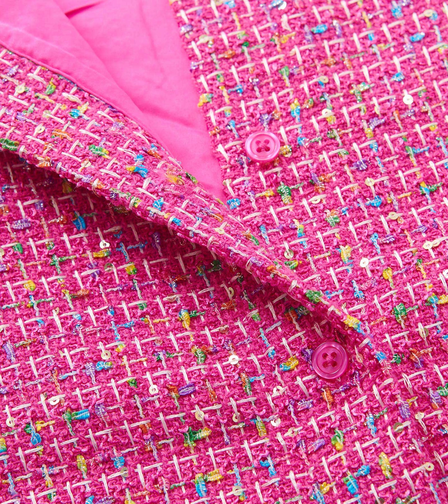 Pink tweed dress with colorful flecks and a button closure, featuring a smooth inner lining.