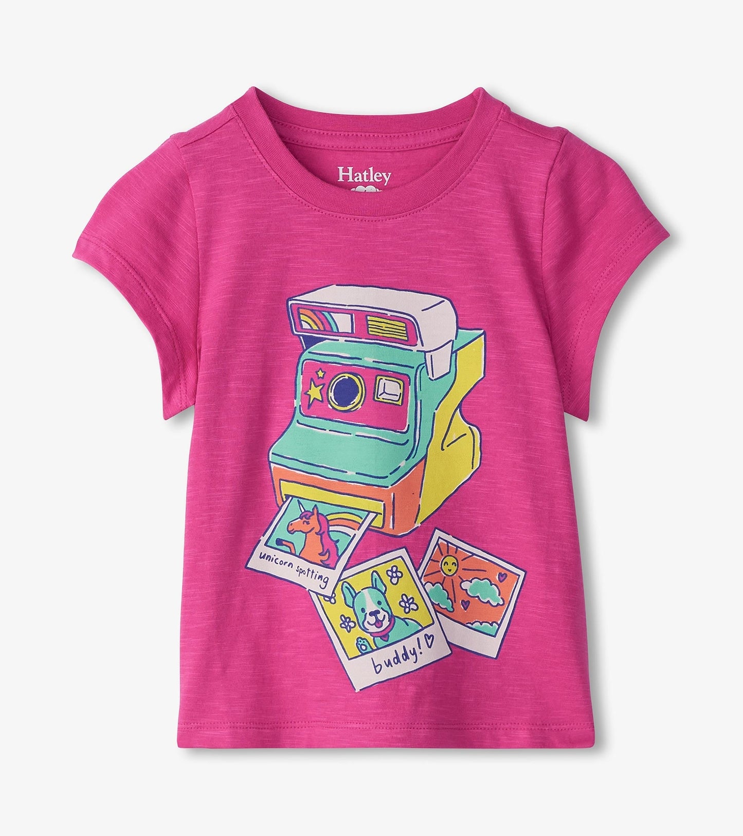 Bright pink short-sleeve tee featuring a colorful graphic of a vintage camera and playful photo prints.