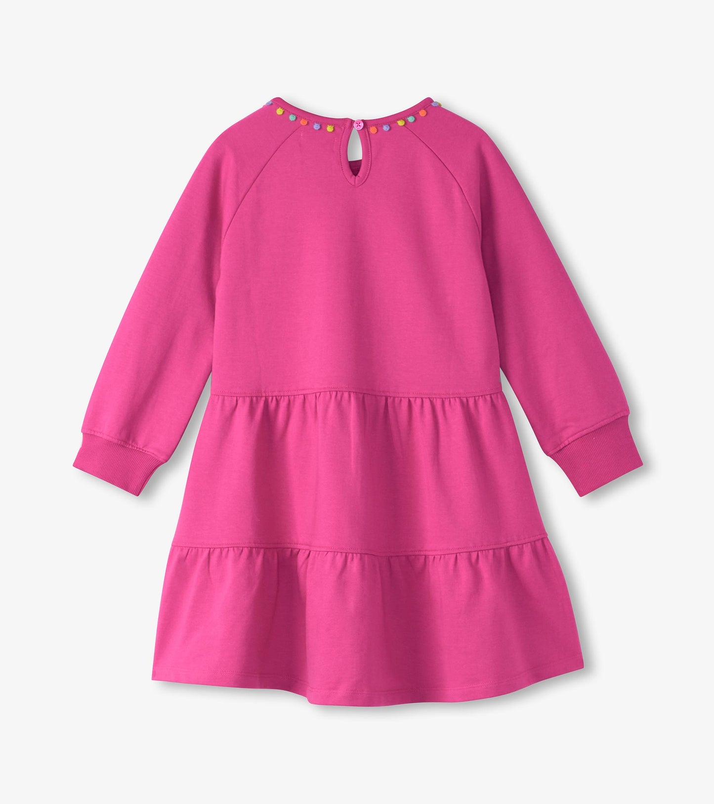Pink gathered tiered dress with long sleeves and colorful button accents at the back.