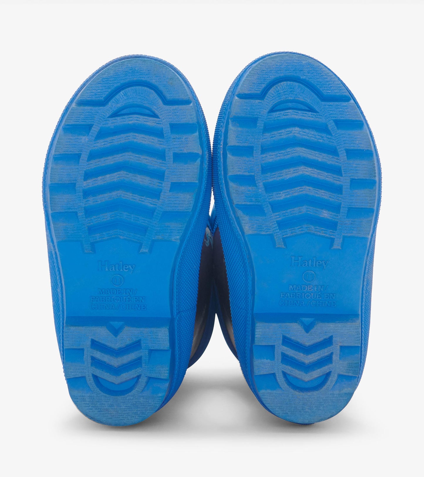 Blue rubber rain boots with textured soles, designed for toddlers, featuring a sherpa lining for warmth.