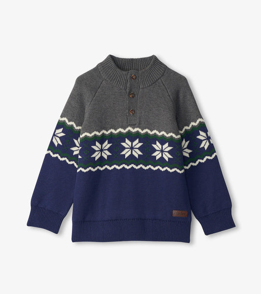 Gray and navy knit mockneck sweater with snowflake pattern and button placket, suitable for winter wear.