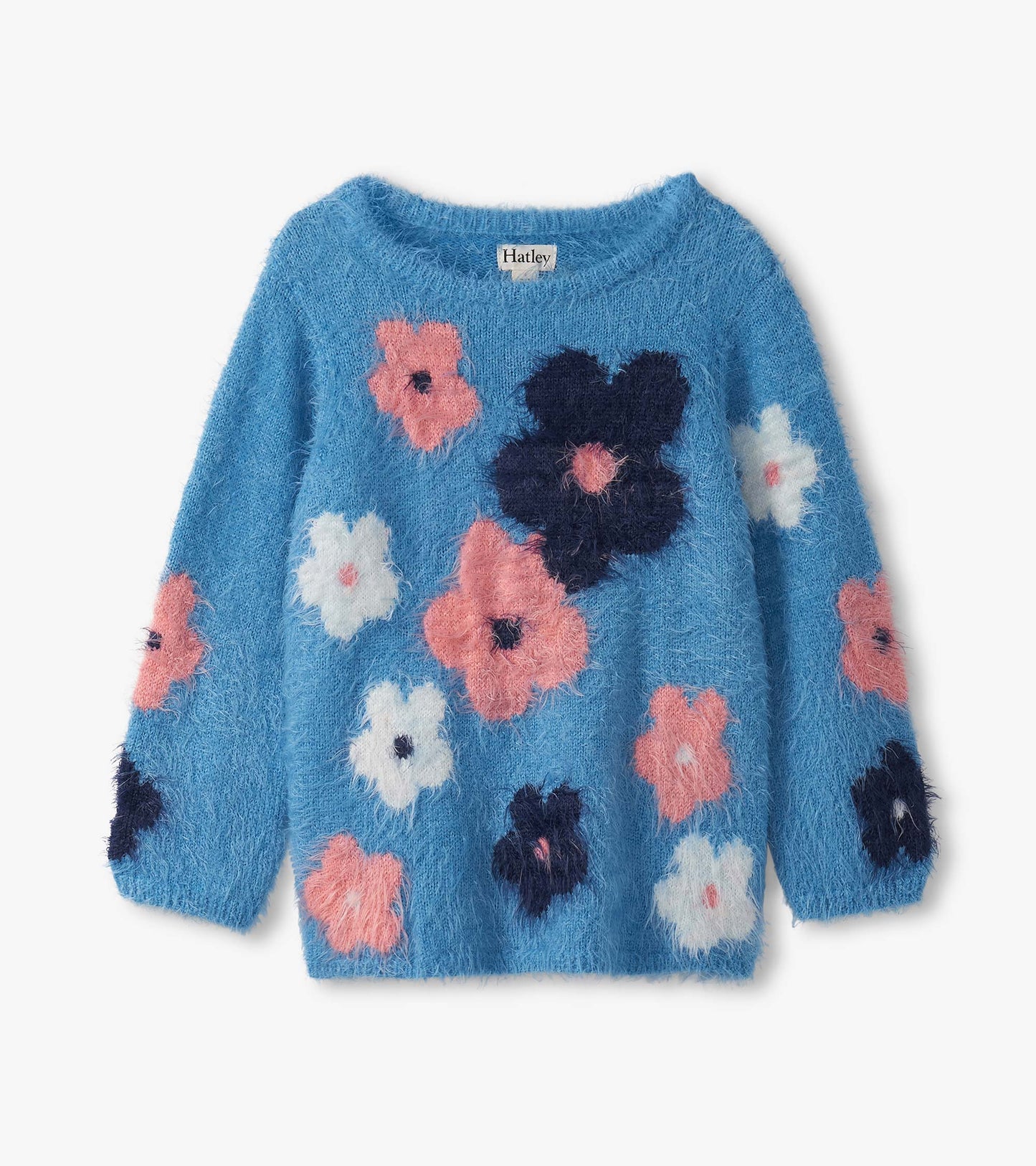 Blue furry sweater featuring colorful floral patterns in pink, white, and navy, with a relaxed fit and long sleeves.