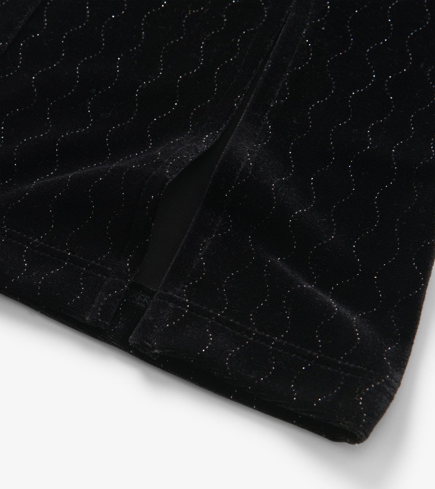 Black velour flared pants featuring a wavy pattern with subtle sparkle, ideal for casual or dressy occasions.