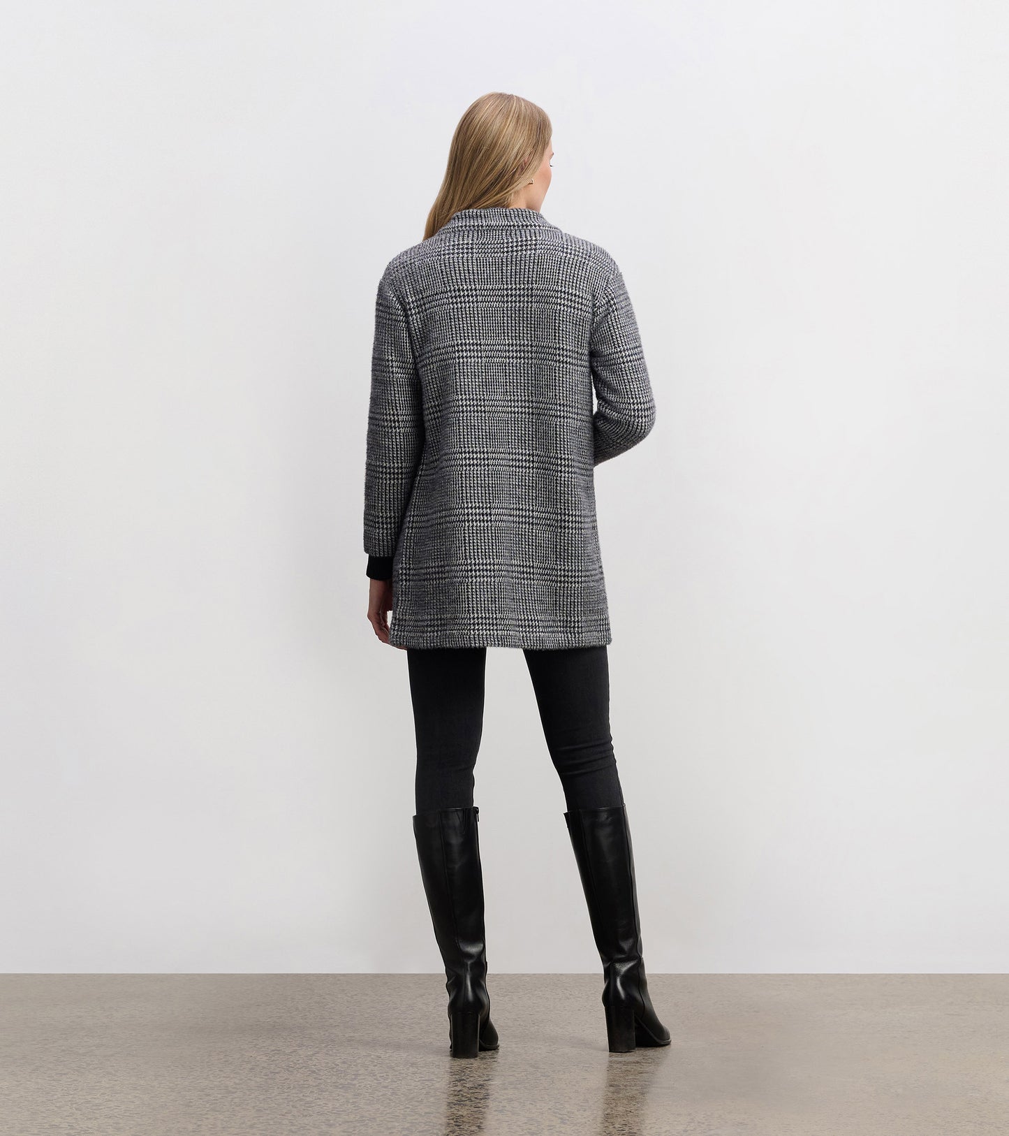 Black check open blazer with a relaxed fit, featuring long sleeves and a collar, viewed from the back.
