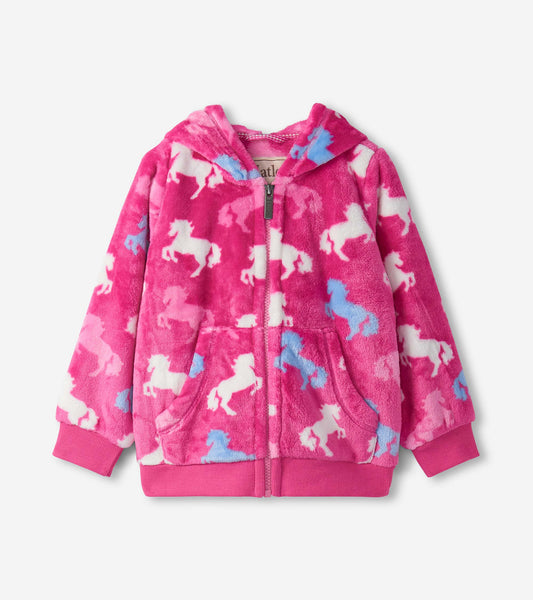 Pink fleece zip-up hoodie featuring a playful unicorn pattern in white and blue, with a hood and front pockets.